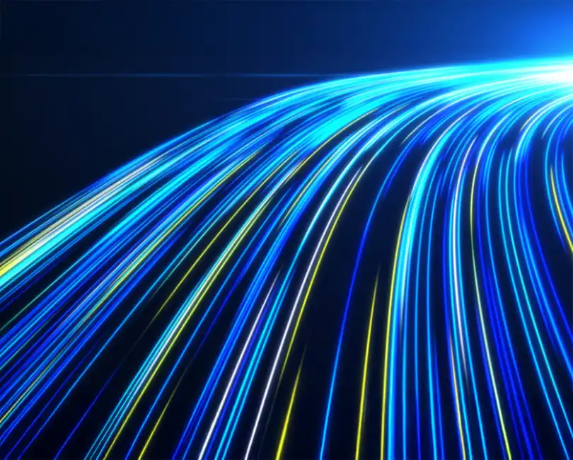 Blue and yellow light trails curve across a dark background, creating an abstract effect that suggests speed, motion, and technology.