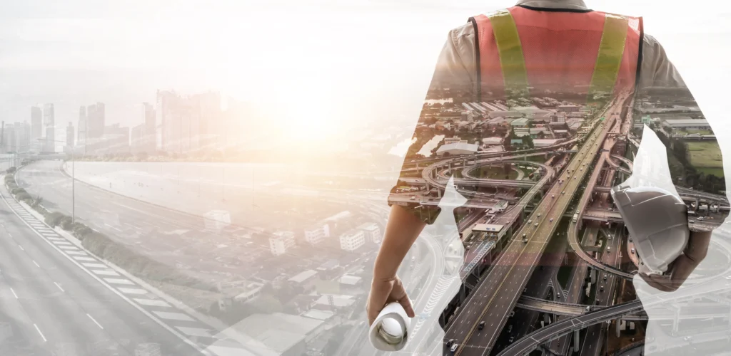 AE professional looking over a highway, representing strategic navigation for the 2026 NCM Rebuild.