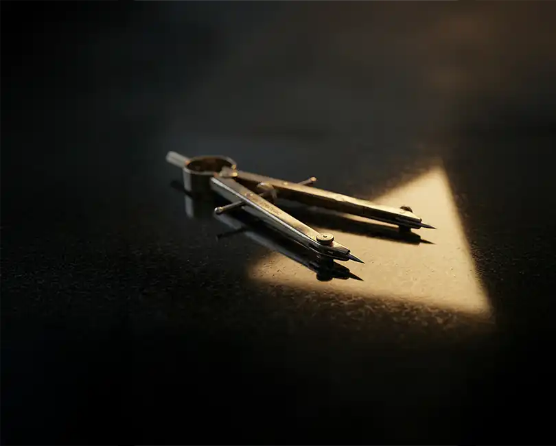 AEC drafting tool: A brass compass on black granite, with a light beam, symbolizing the AEC Family Office model.